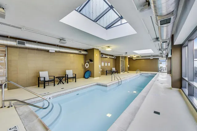 a media room with lots of chairs and a projector screen