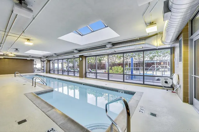 a living room with lots of furniture and a wooden floor