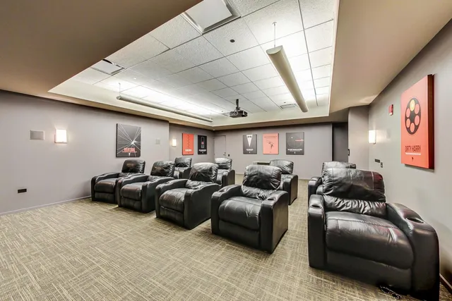 a living room with lots of furniture and a table