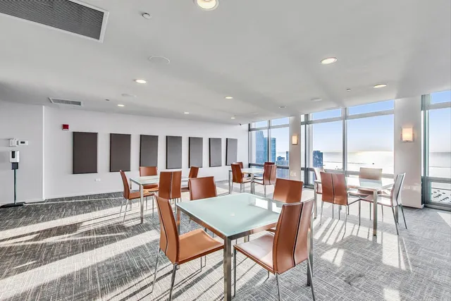 a kitchen with stainless steel appliances granite countertop a sink and a refrigerator