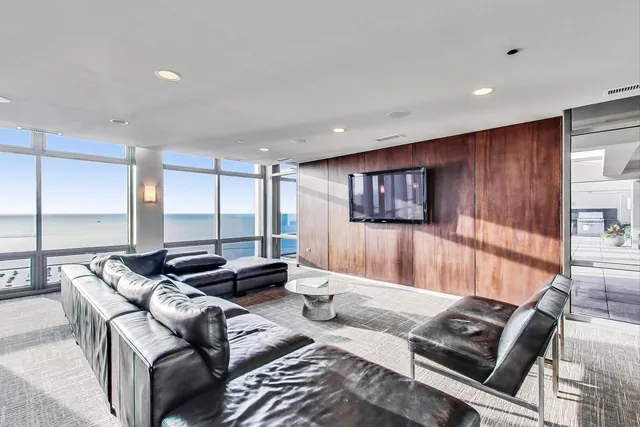 a living room with furniture and a rug