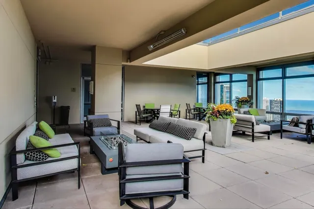 a view of a chairs and table in a patio