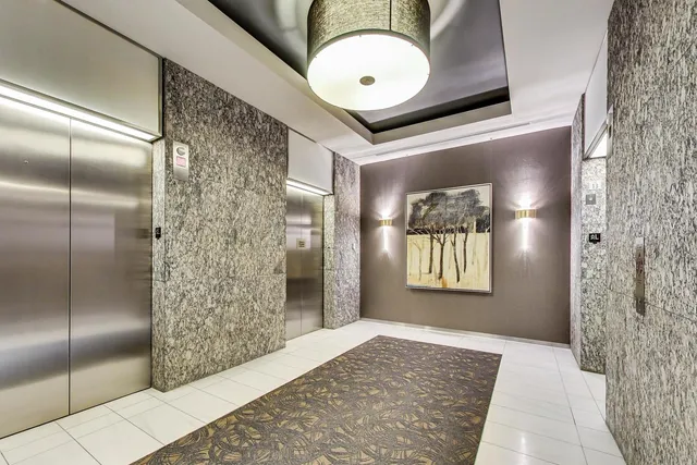 a view of hallway with wooden floor