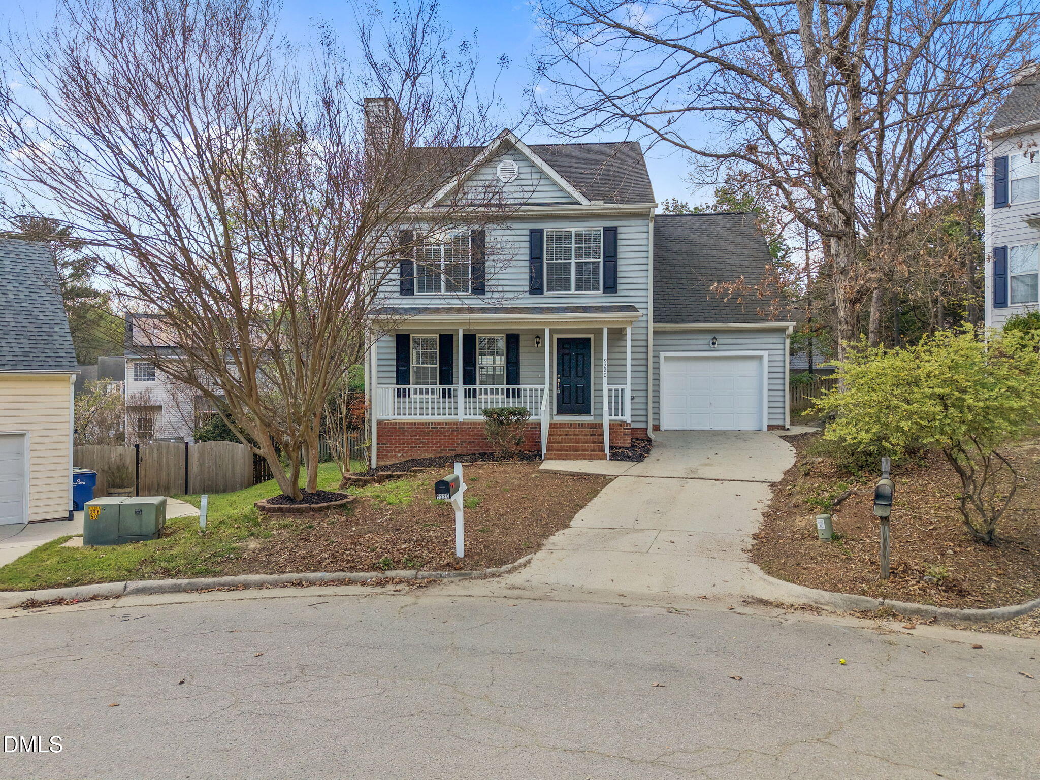 9220 Pennythorne Court Raleigh, NC 27615 - Photo 7 of 49 a front view of a house with a yard and garage
