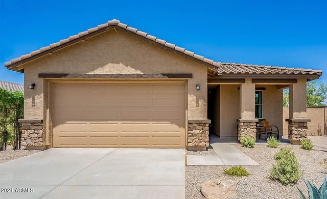 a front view of a house with garage