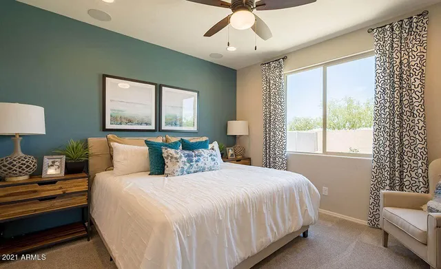 a bedroom with bed and window