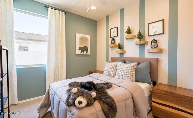 a bedroom with a bed and a window