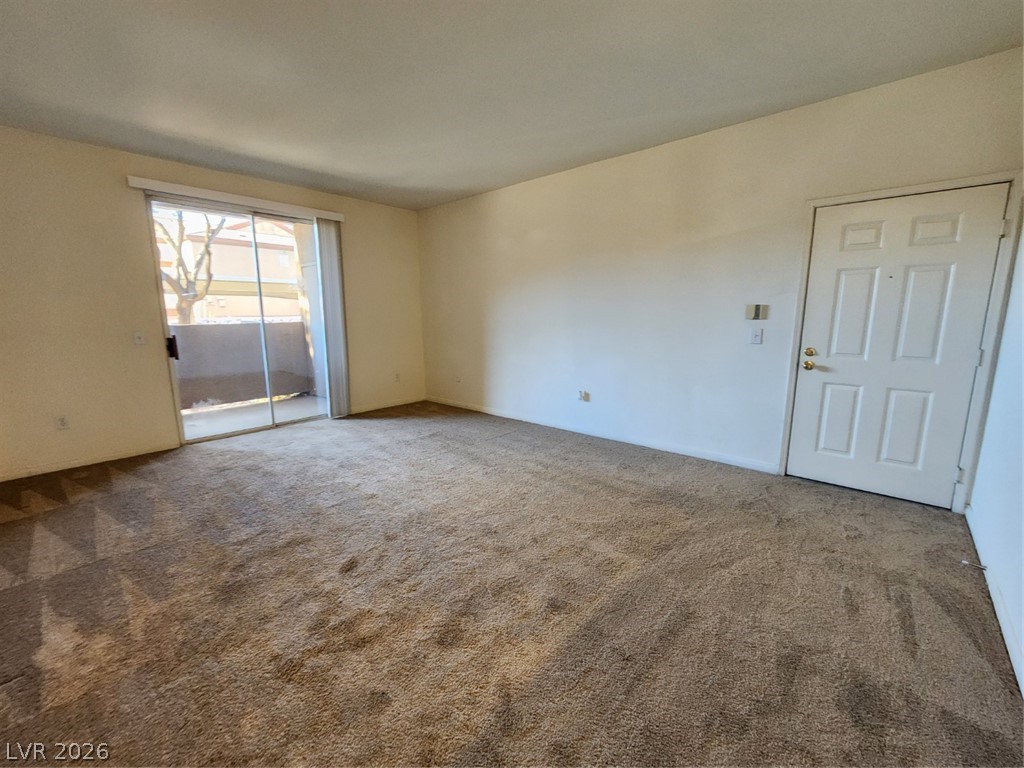 231 West Horizon Ridge Parkway, Unit 417 Henderson, NV 89012 - Photo 8 of 39 Empty room featuring carpet floors