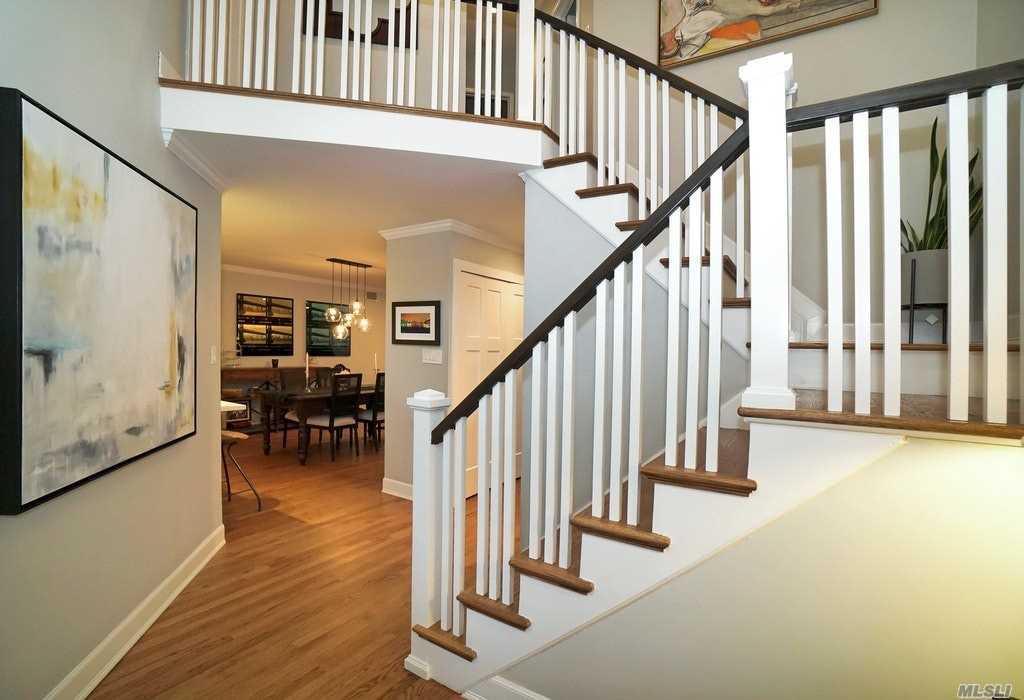 a view of entryway with dining room and stairs