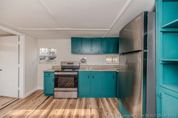 a kitchen with wooden cabinets and a sink
