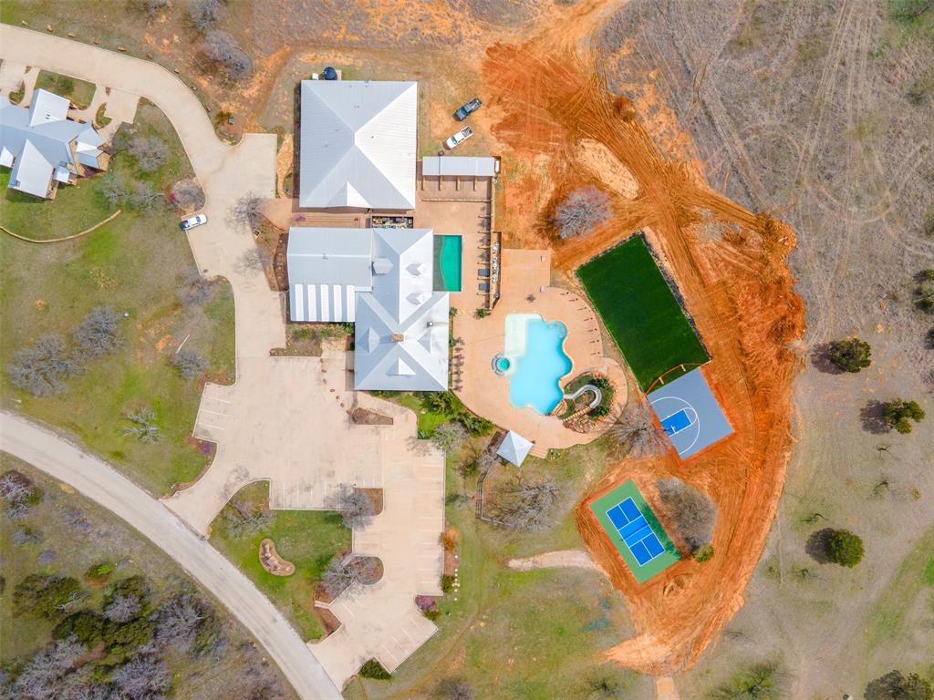 E49 R Art's Way Gordon, TX 76453 - Photo 11 of 26 an aerial view of a house with a swimming pool