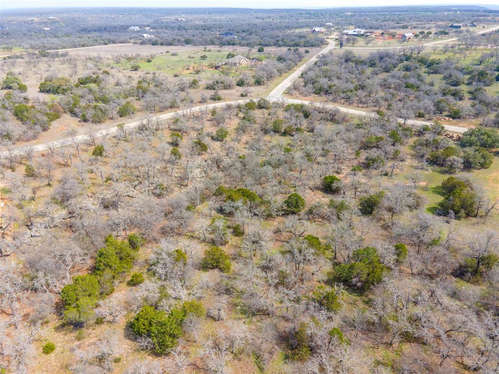E49 R Art's Way Gordon, TX 76453 - Photo 18 of 26 a view of a field with trees in the background