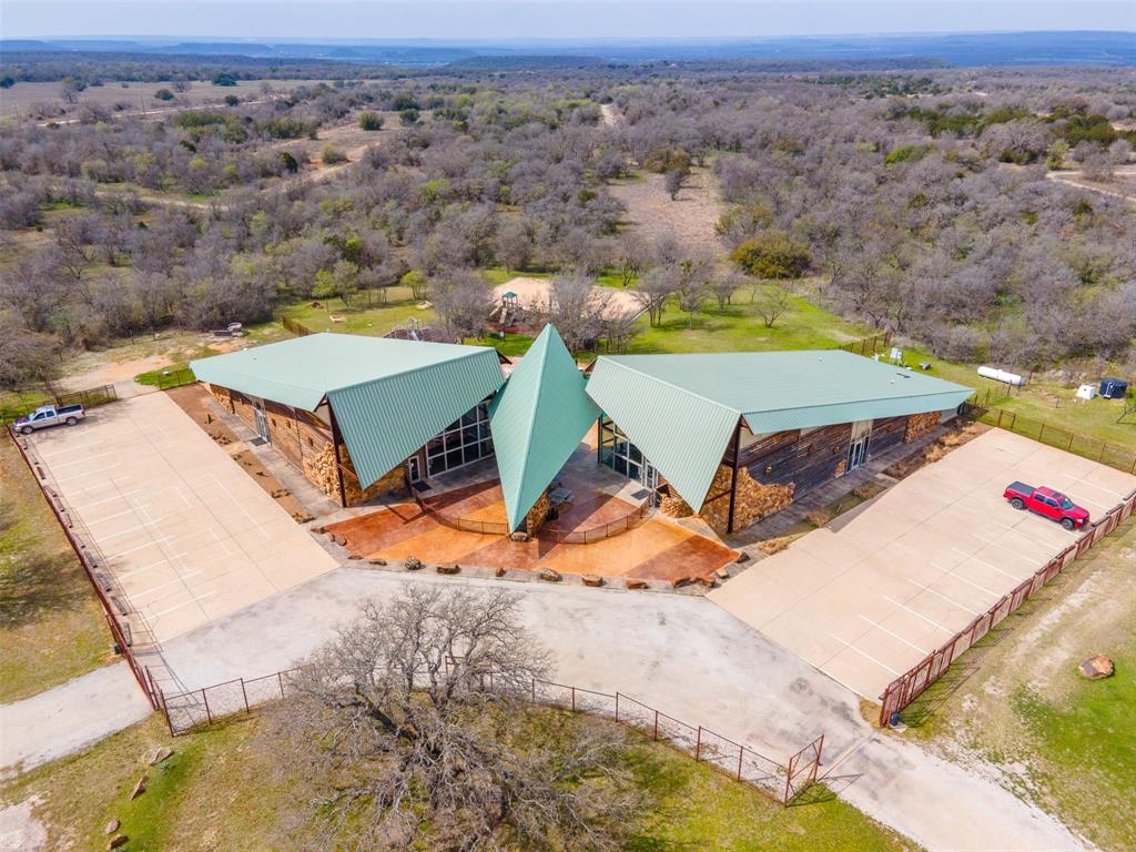 E49 R Art's Way Gordon, TX 76453 - Photo 22 of 26 an aerial view of a house with a yard