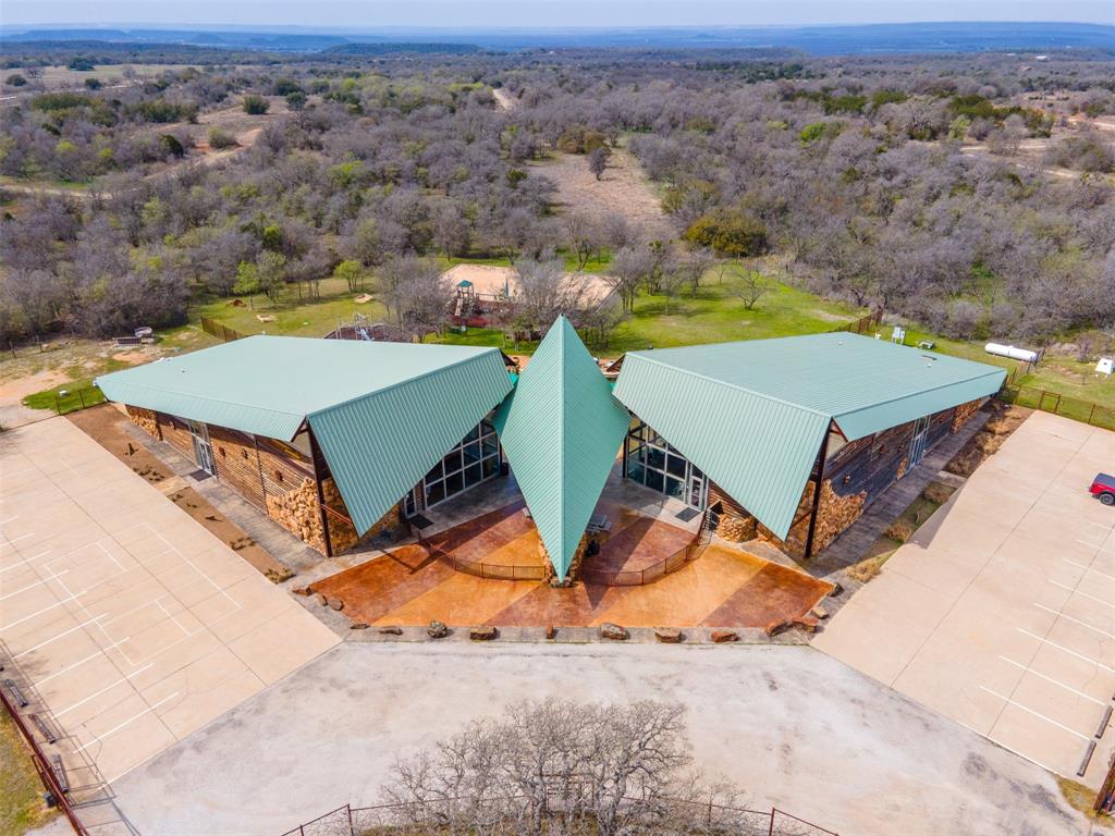 E49 R Art's Way Gordon, TX 76453 - Photo 23 of 26 an aerial view of a backyard with table and chairs
