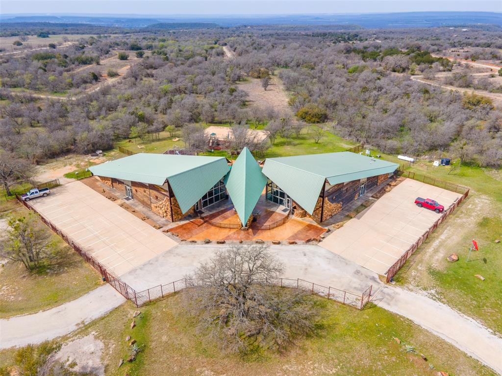 E49 R Art's Way Gordon, TX 76453 - Photo 24 of 26 an aerial view of a house with a swimming pool