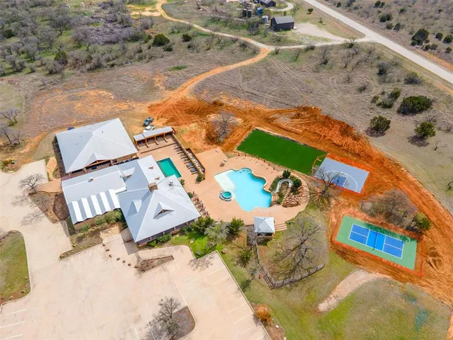 an aerial view of a house with a swimming pool