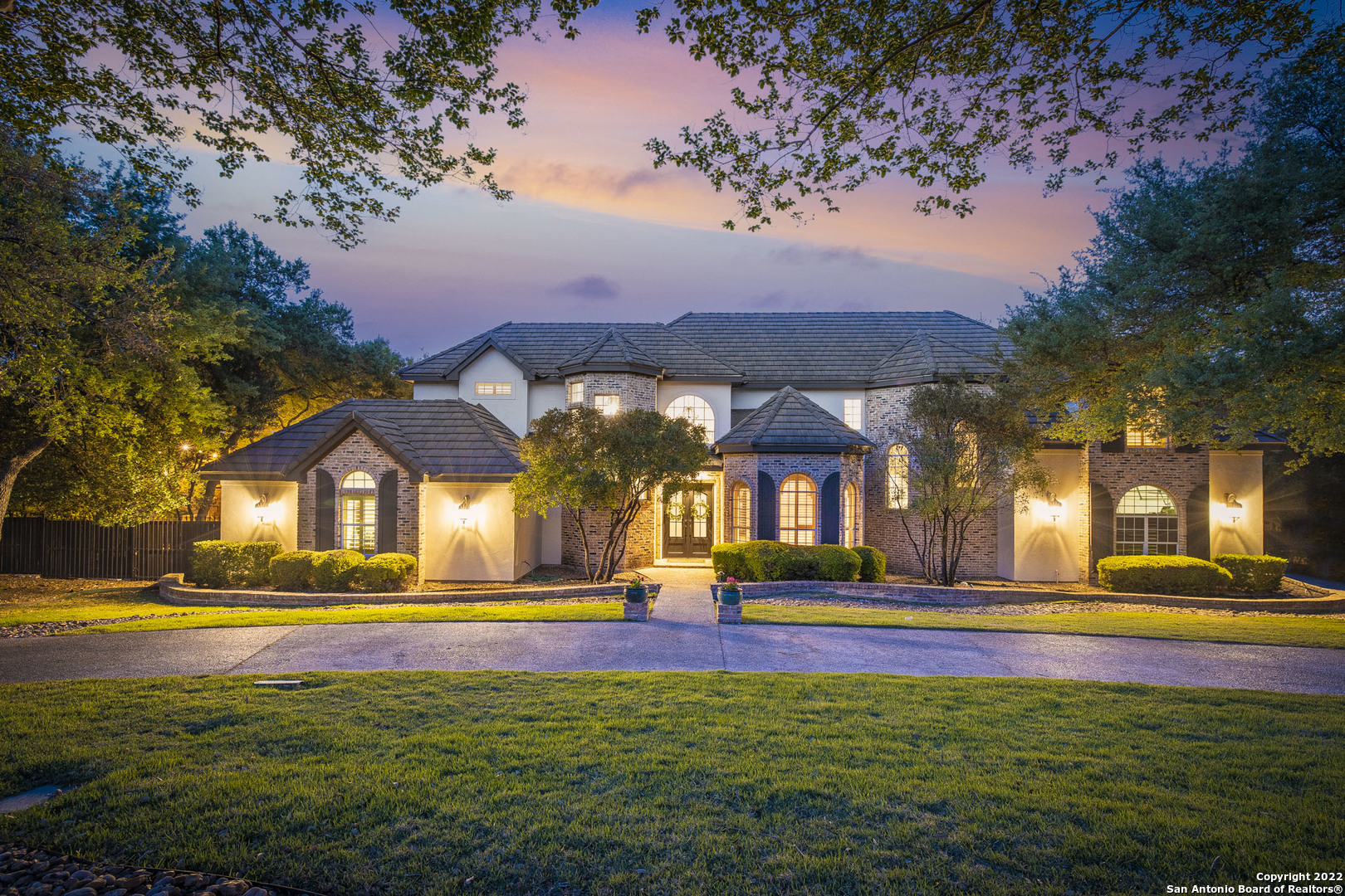 a front view of house with yard and green space
