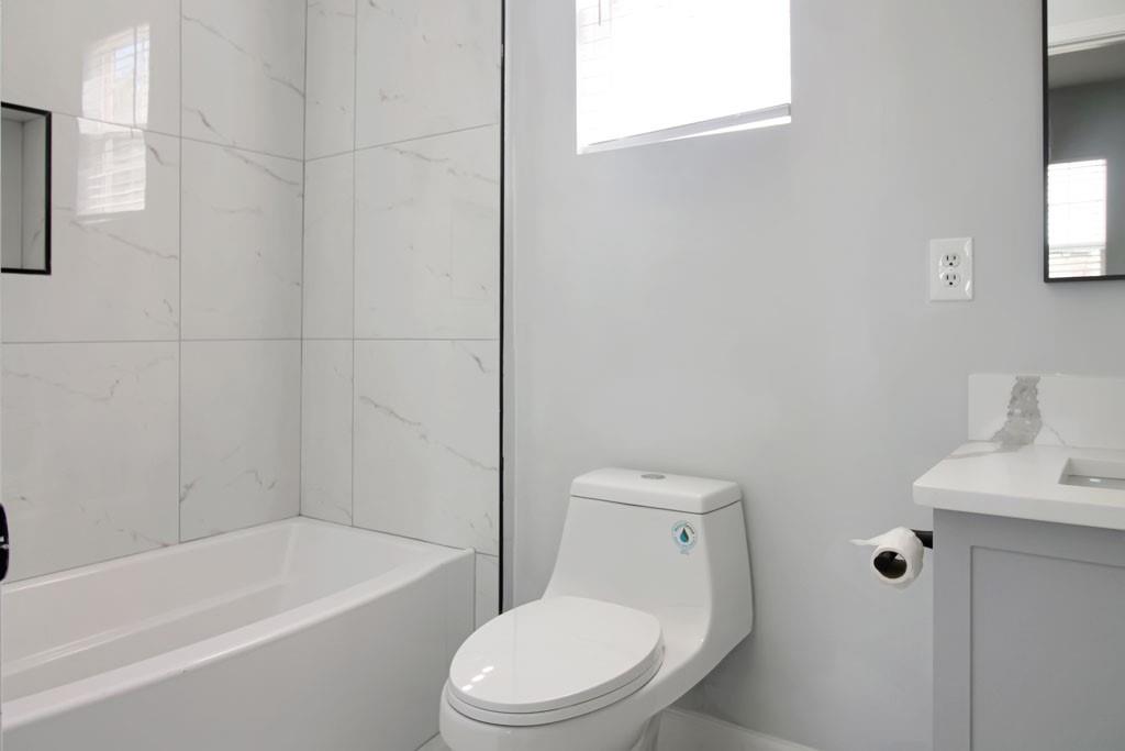 3087 Semmes Street Atlanta, GA 30344 - Photo 13 of 18 a white toilet sitting next to a bath tub