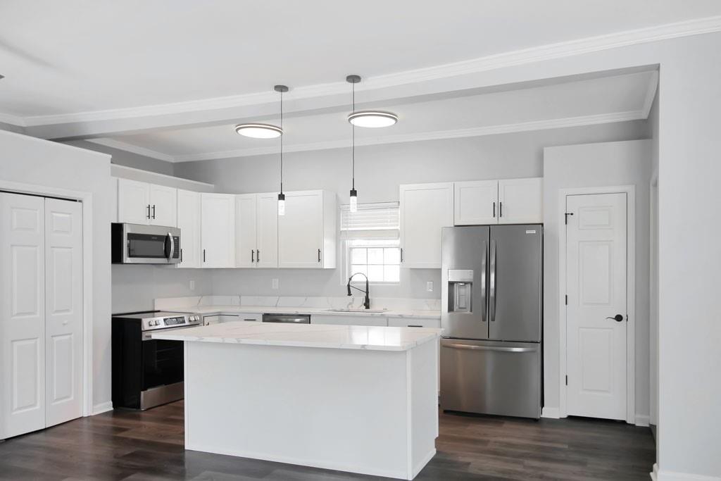 3087 Semmes Street Atlanta, GA 30344 - Photo 4 of 18 a kitchen with stainless steel appliances a refrigerator sink and microwave