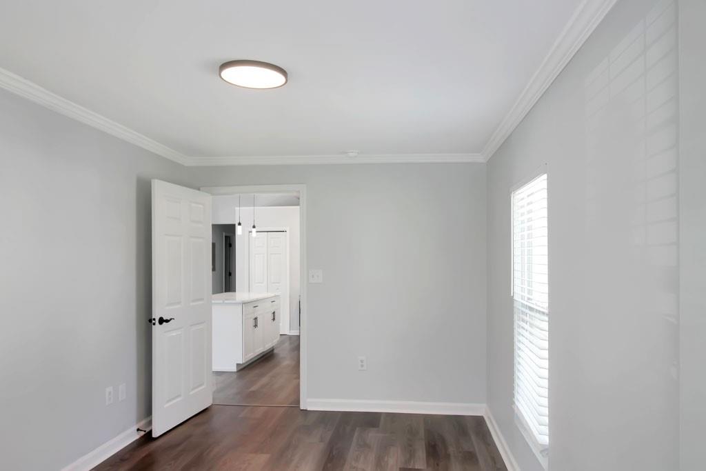3087 Semmes Street Atlanta, GA 30344 - Photo 7 of 18 a view of empty room with wooden floor and window