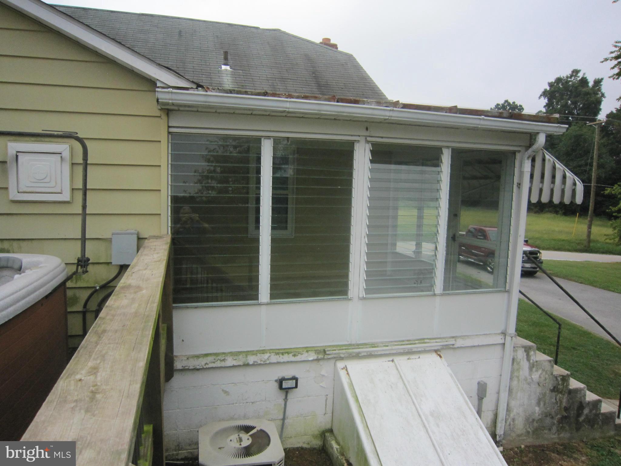 4000 Maple Grove Road Hampstead, MD 21074 - Photo 19 of 28 Enclosed rear porch and basement exit