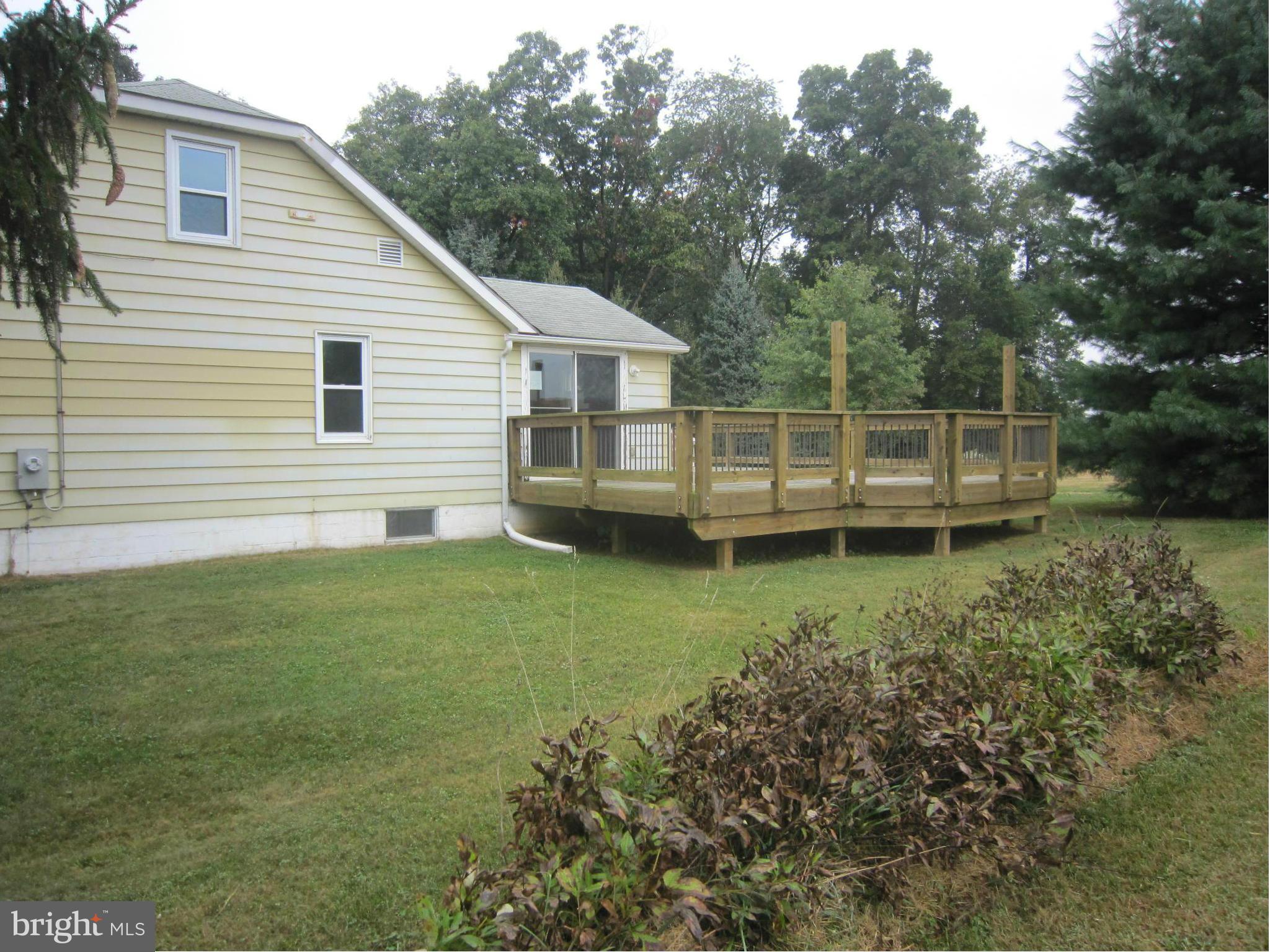 4000 Maple Grove Road Hampstead, MD 21074 - Photo 3 of 28 Side view of home and deck