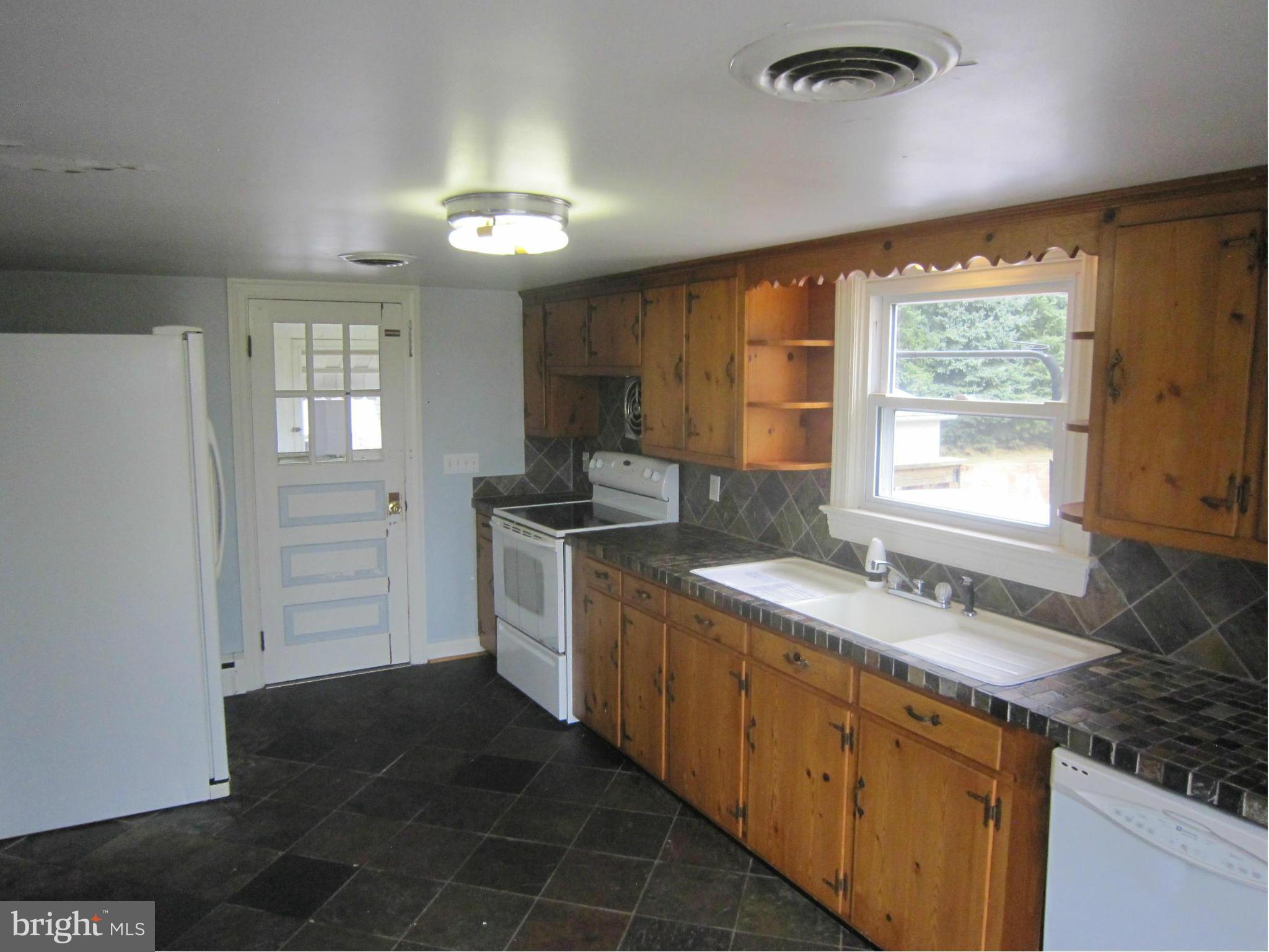 4000 Maple Grove Road Hampstead, MD 21074 - Photo 9 of 28 Kitchen with ceramic floor, counter and backsplash
