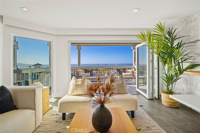 a living room with furniture flowerpot and a potted plant