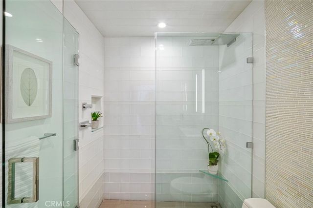 a bathroom with a shower and toilet