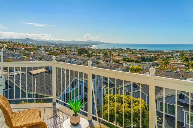 a view of a city that has lawn chairs