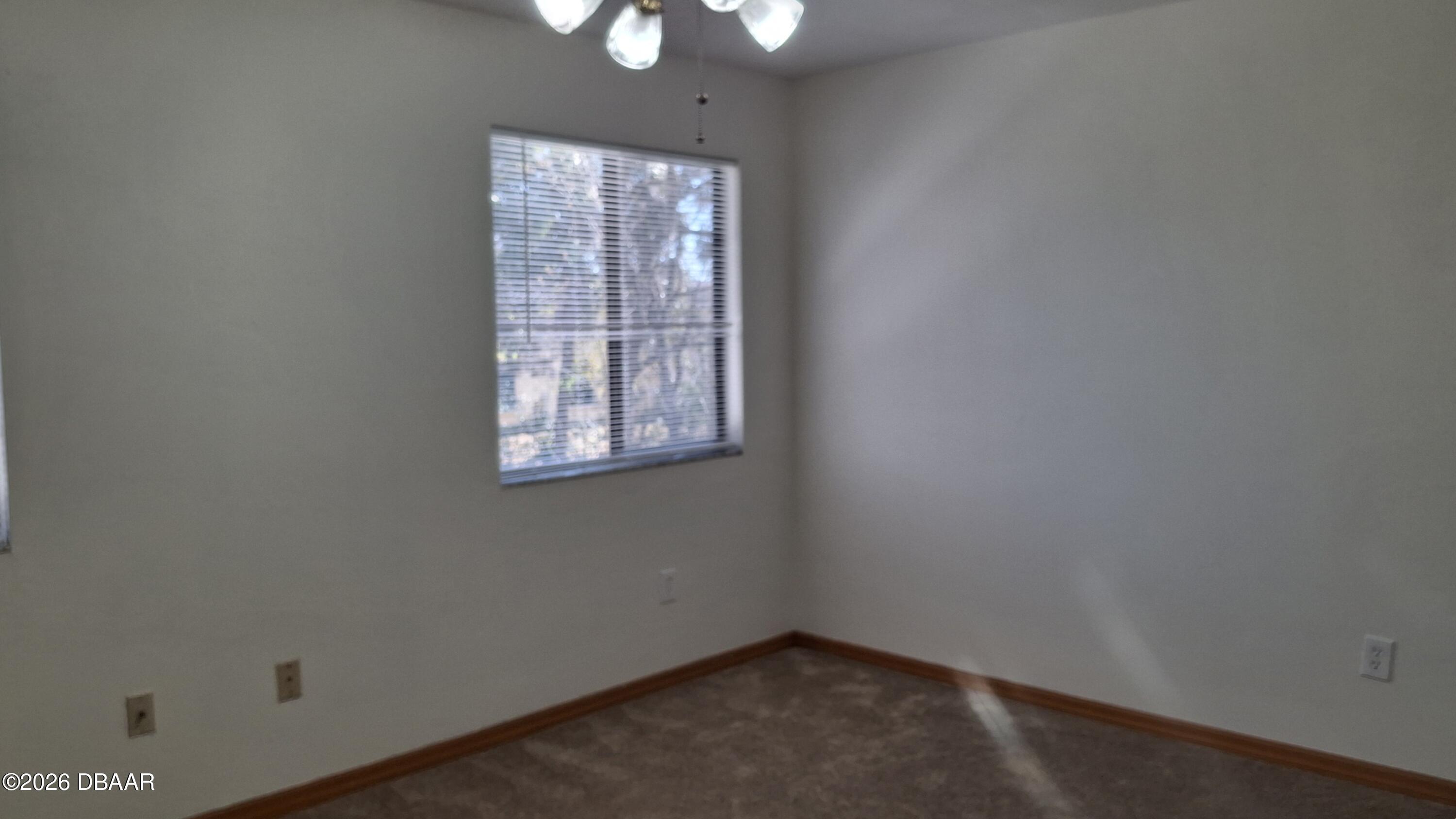 1302 Deer Springs Road Port Orange, FL 32129 - Photo 29 of 43 an empty room with a window