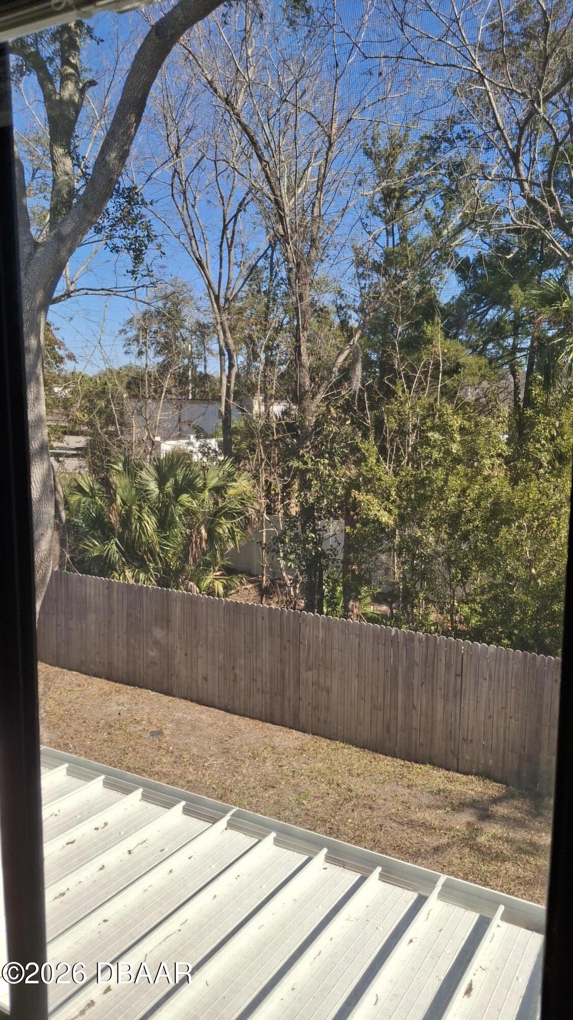 1302 Deer Springs Road Port Orange, FL 32129 - Photo 31 of 43 a view of backyard with wooden fence