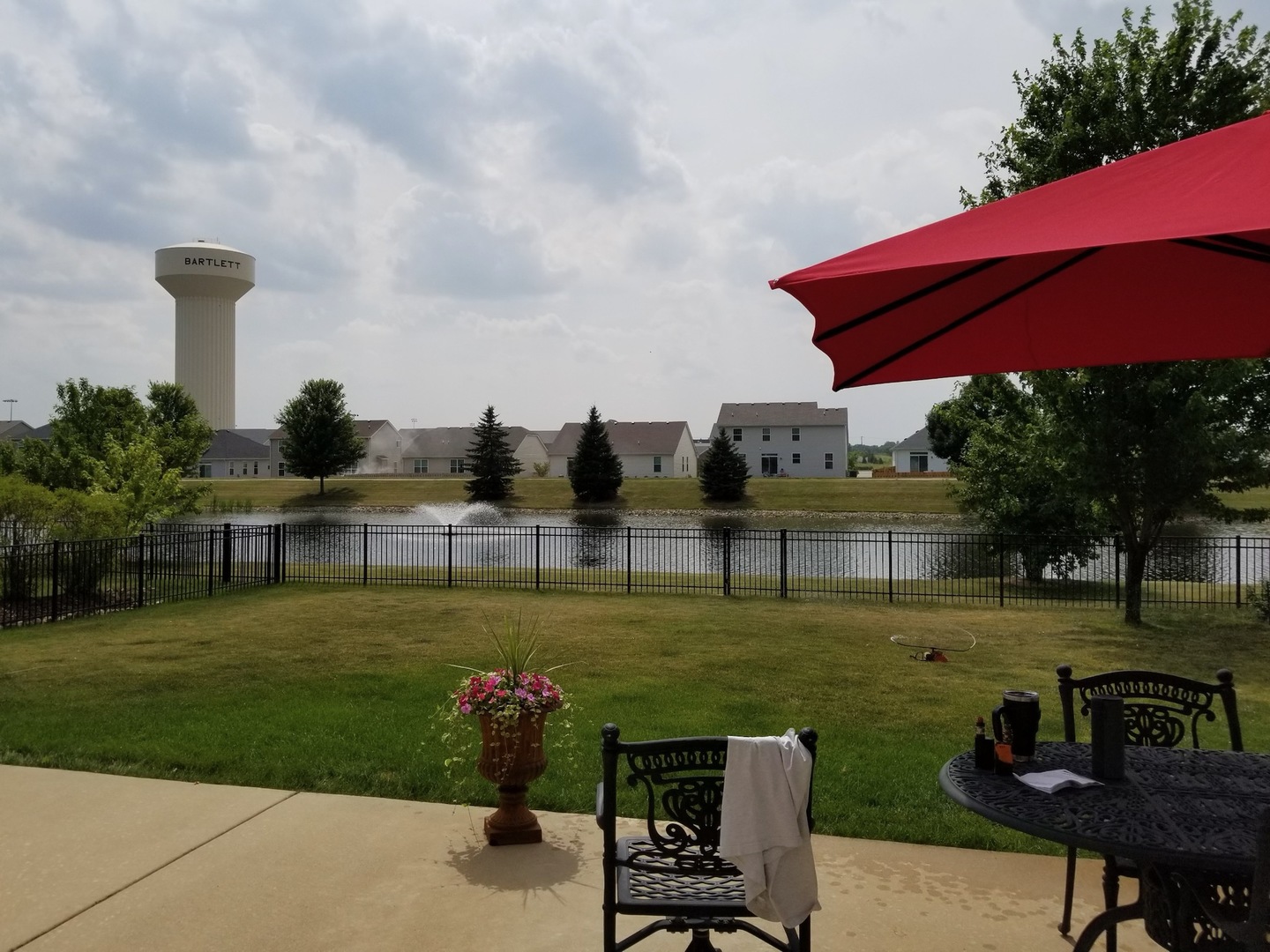150 Fieldcrest Drive Bartlett, IL 60103 - Photo 3 of 4 a view of a lake with a yard