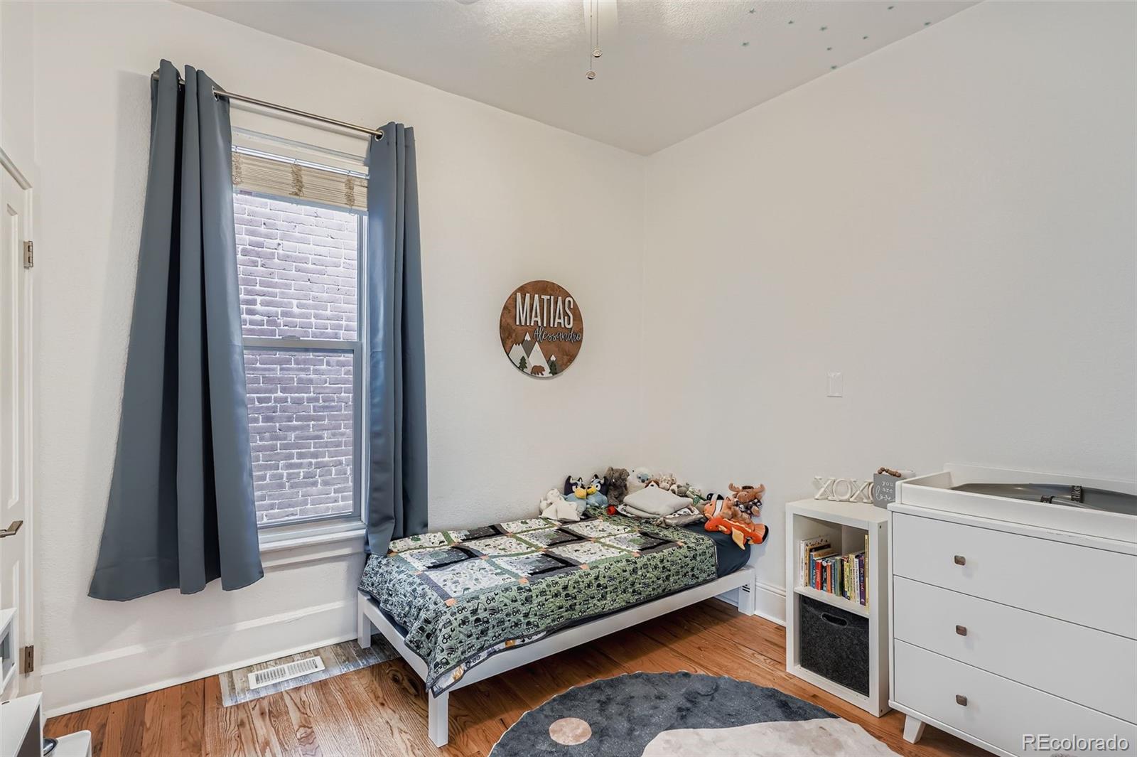 3531 Quitman Street Denver, CO 80212 - Photo 13 of 26 a bed room with a bed and a window
