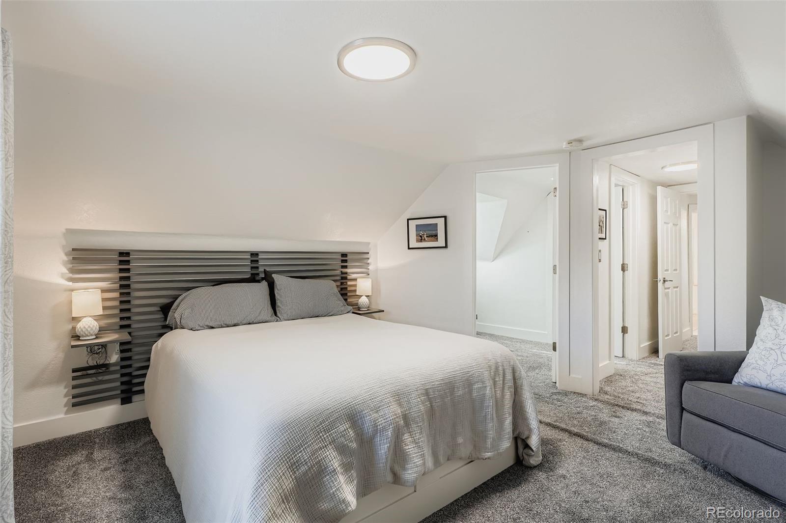 3531 Quitman Street Denver, CO 80212 - Photo 16 of 26 a bedroom with a bed and a couch