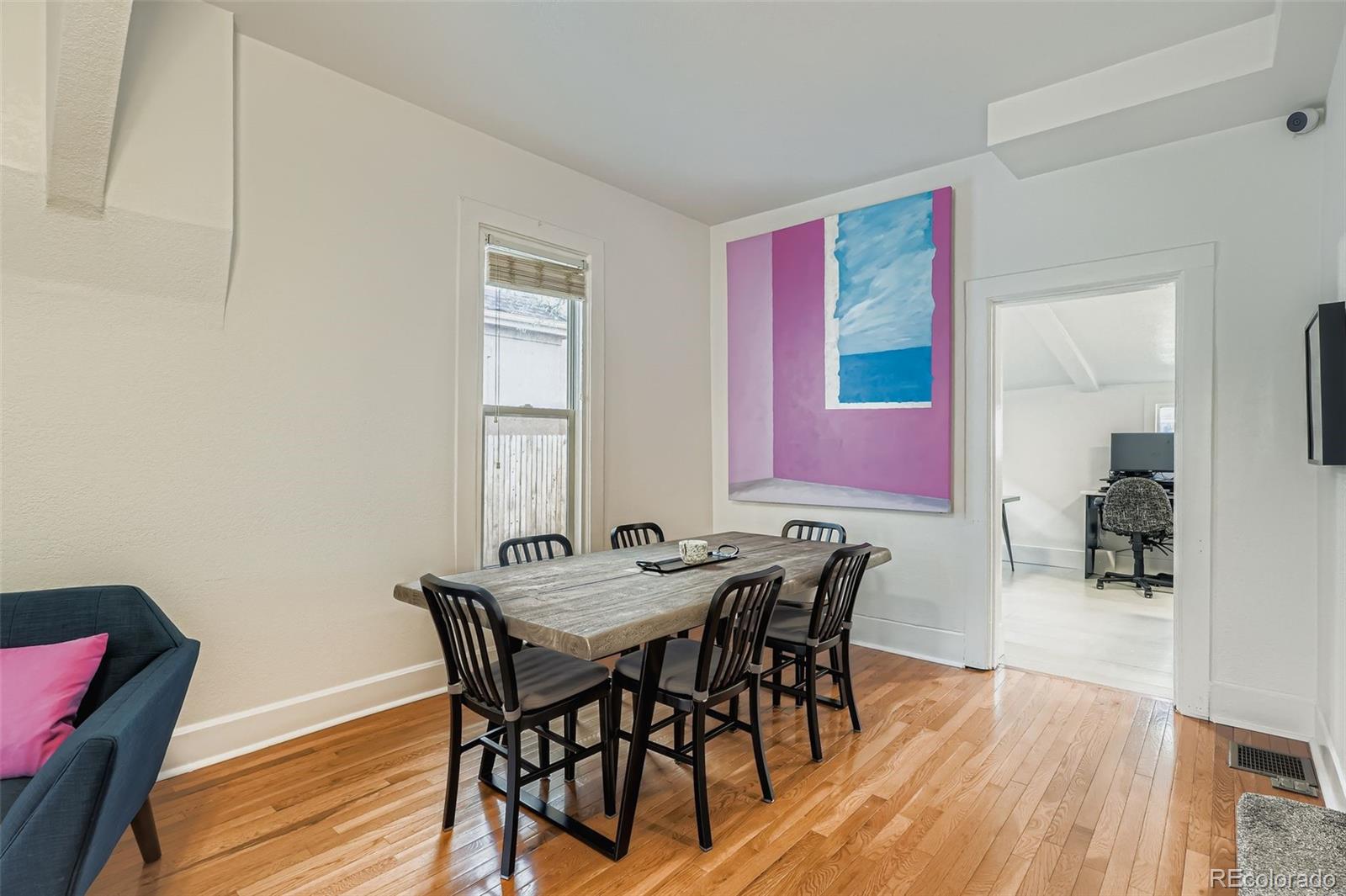 3531 Quitman Street Denver, CO 80212 - Photo 7 of 26 a view of a dining room with furniture and wooden floor
