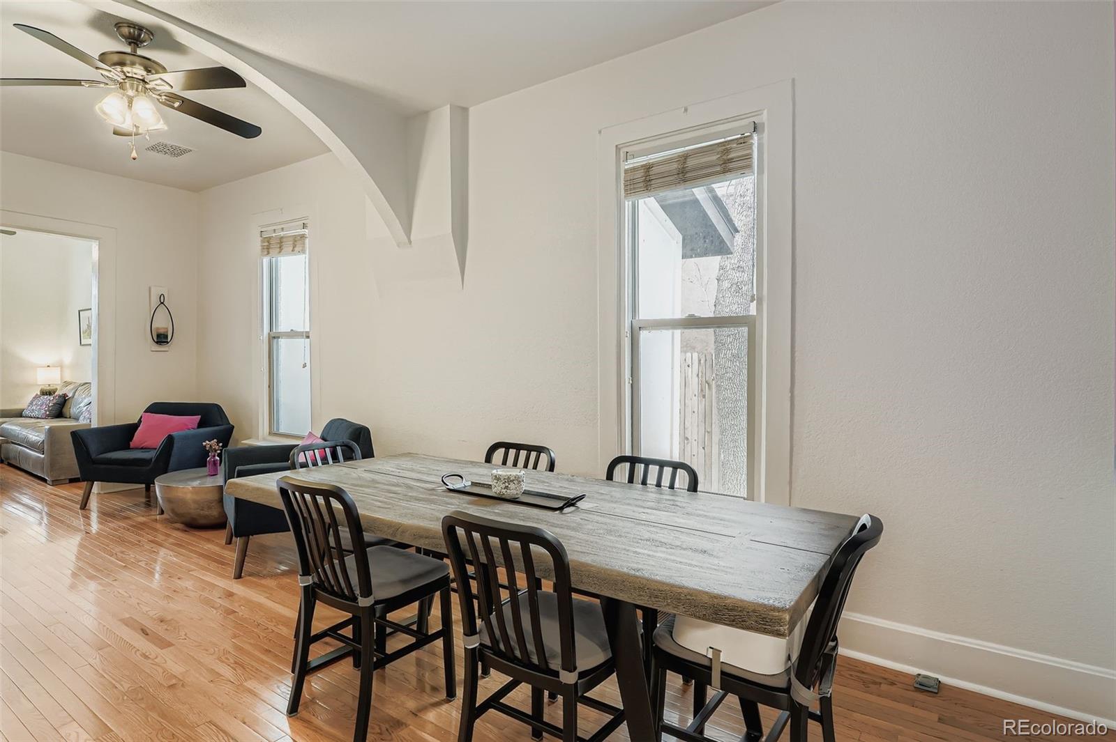 3531 Quitman Street Denver, CO 80212 - Photo 9 of 26 a view of a dining room with furniture and wooden floor