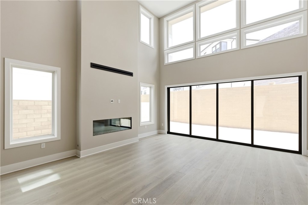 156 Apron Irvine, CA 92618 - Photo 10 of 40 an empty room with large windows