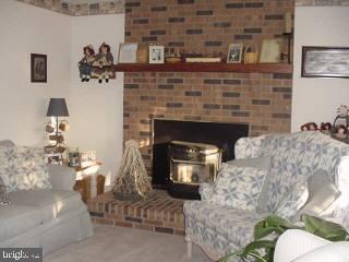 33364 Bob Smith Road Delmar, MD 21875 - Photo 4 of 6 a living room with furniture and a fireplace