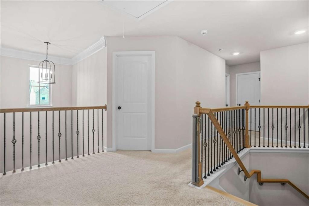 361 Traditions Lane Hampton, GA 30228 - Photo 16 of 35 a view of a hallway with a bedroom and windows