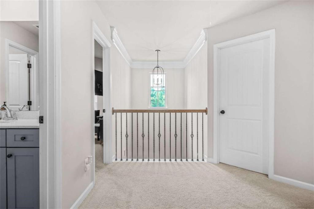 361 Traditions Lane Hampton, GA 30228 - Photo 17 of 35 a view of a hallway with windows