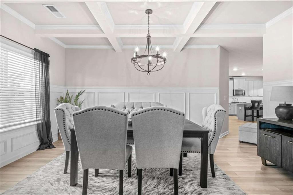 361 Traditions Lane Hampton, GA 30228 - Photo 7 of 35 a dining room with furniture and window