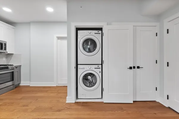 a utility room with sink dryer and washer