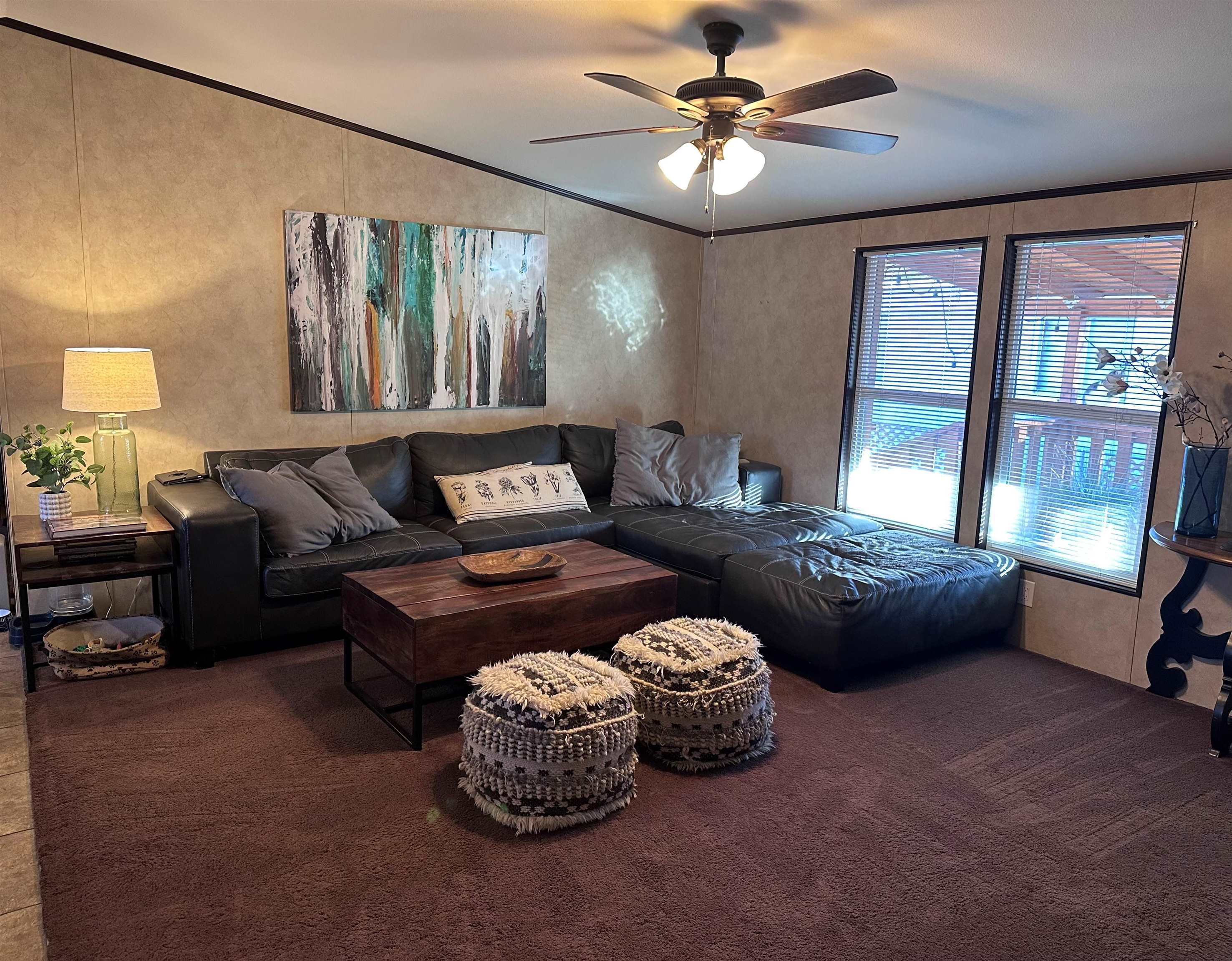 585-25 25 1/2 Road, Unit 125 Grand Junction, CO 81505 - Photo 10 of 24 a living room with furniture and a large window