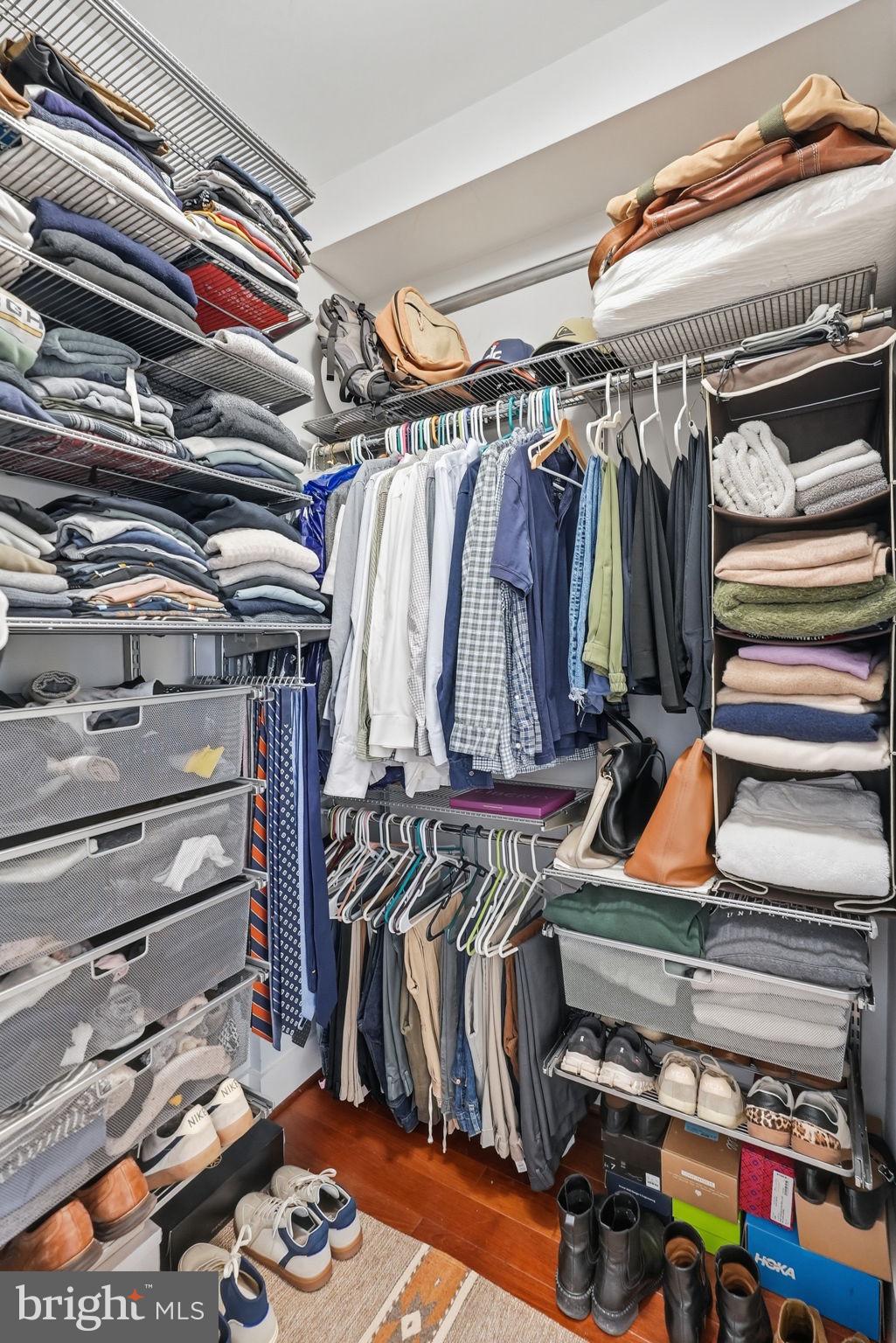 1700 Euclid Street Northwest, Unit B3 Washington, DC 20009 - Photo 11 of 17 a view of walk in closet with clothes and shoes