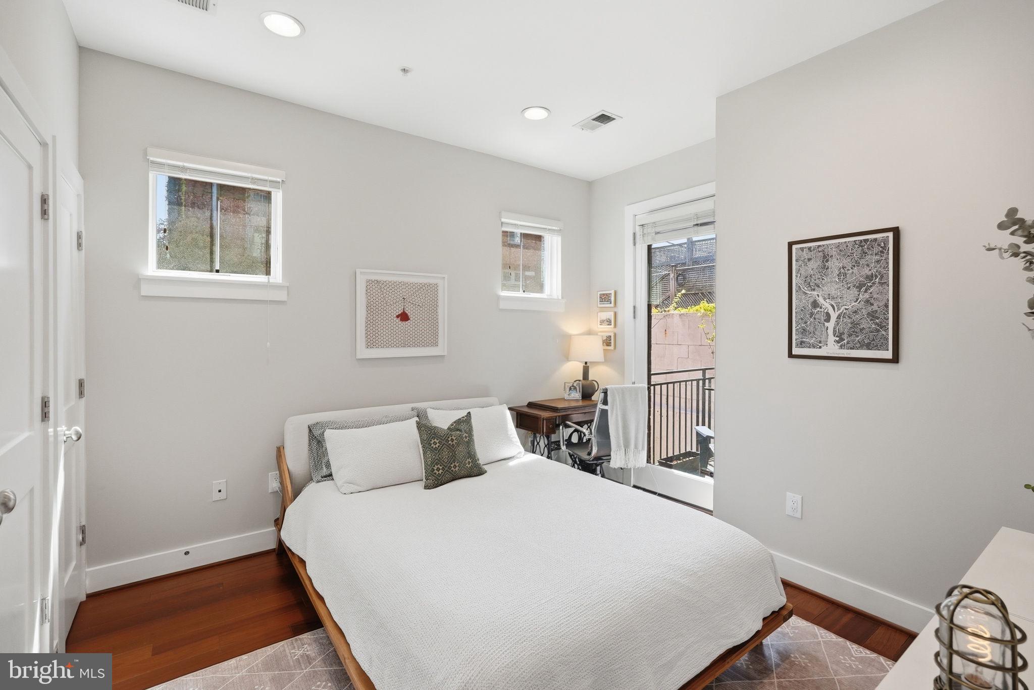 1700 Euclid Street Northwest, Unit B3 Washington, DC 20009 - Photo 13 of 17 a bedroom with a bed and a window