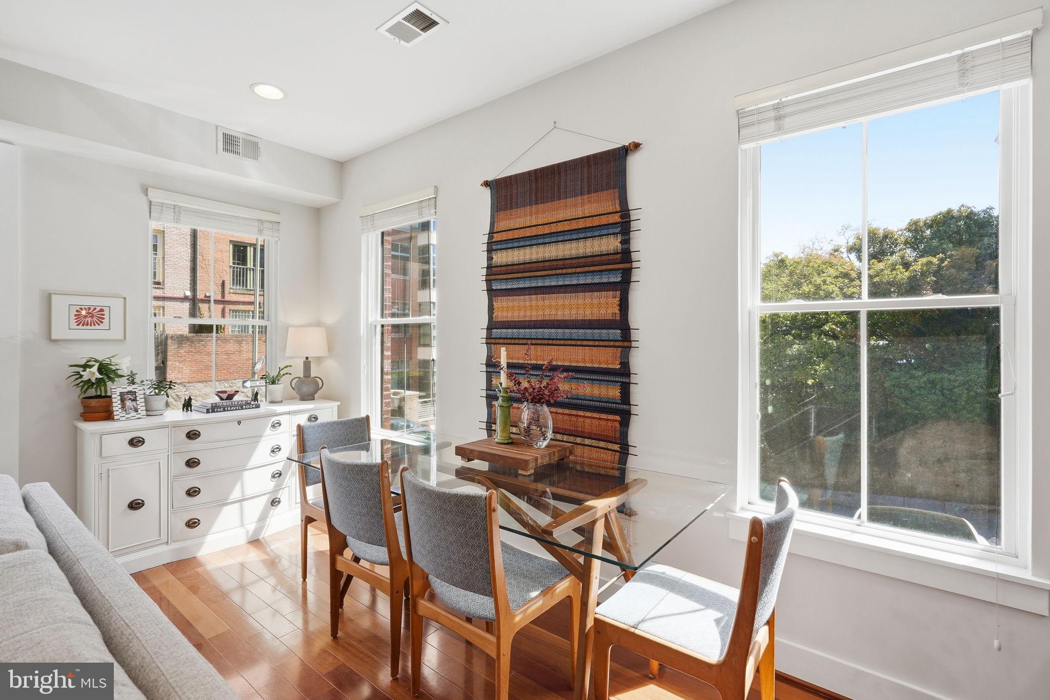 1700 Euclid Street Northwest, Unit B3 Washington, DC 20009 - Photo 4 of 17 a view of a dining room with furniture window and outside view