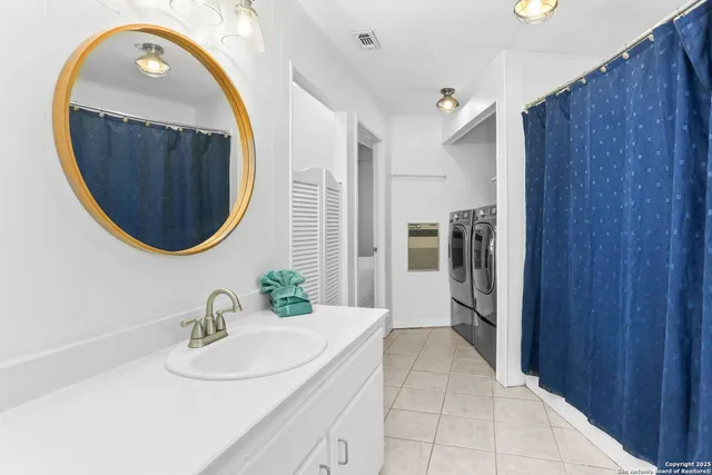 a bathroom with a sink and a mirror