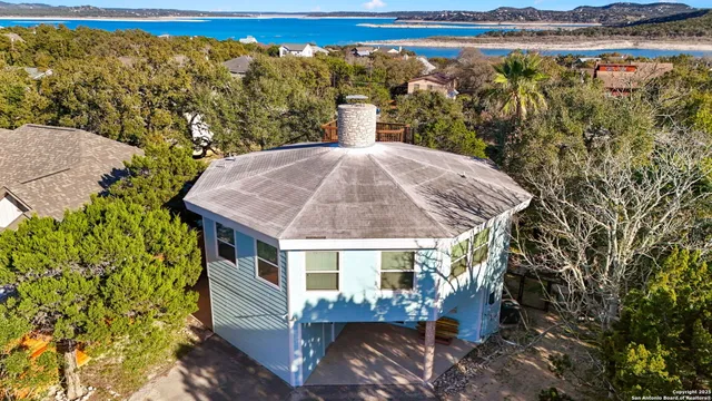 a view of a house with a yard from a balcony