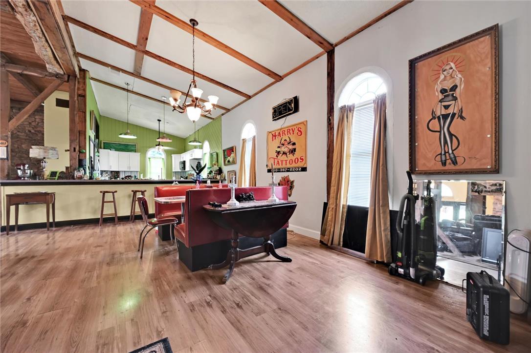 101 Conrad Road Fleetwood, PA 19522 - Photo 42 of 42 An open floorplan with high ceilings and exposed beams connects the kitchen and dining area.